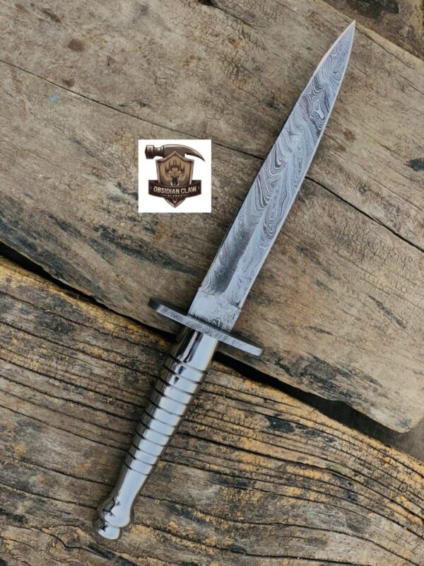 Handmade High carbon Damascus steel Dagger knife with leather sheath.  

Overall length: "13" inches. 

BLADE LENGTH: "9" inches.  

Handle Length: "4" inches. - Image 2