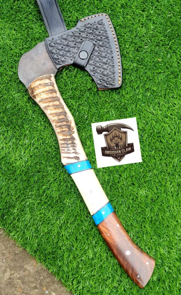 Handmade 1095 high carbon steel vikings  throwing hatchet  with leather cover. 
Handle made with the combination  of ram horn and camel bone and rose wood scales . Blue Turkish spacers.  Approximately  17 inches long.
6 inches head width. - Image 4