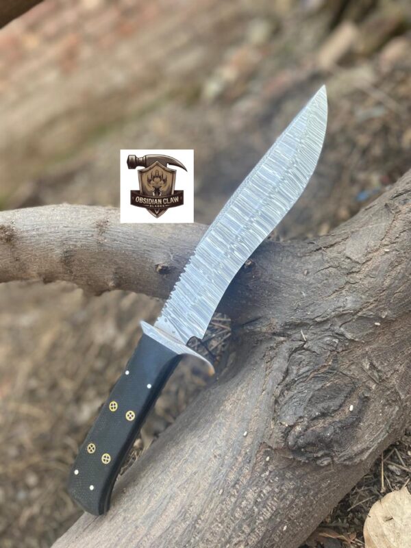 Handmade High carbon Damascus steel Bowie knife with leather sheath.  
Blade Length: [9 ] inches
• ⁠•	Overall Length: [14 ] inches
•	Blade Material: [Damascus steel]
▪︎ Handle Length:  [5] inches.  
•	Handle Material: [Bloster Damascus, Black Micarata, Moasic pin] - Image 3