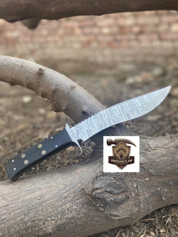 Handmade High carbon Damascus steel Bowie knife with leather sheath.  
Blade Length: [9 ] inches
• ⁠•	Overall Length: [14 ] inches
•	Blade Material: [Damascus steel]
▪︎ Handle Length:  [5] inches.  
•	Handle Material: [Bloster Damascus, Black Micarata, Moasic pin] - Image 2