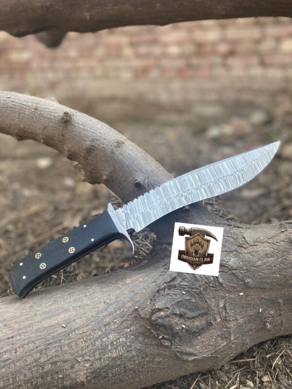 Handmade High carbon Damascus steel Bowie knife with leather sheath.  
Blade Length: [9 ] inches
• ⁠•	Overall Length: [14 ] inches
•	Blade Material: [Damascus steel]
▪︎ Handle Length:  [5] inches.  
•	Handle Material: [Bloster Damascus, Black Micarata, Moasic pin] - Image 4