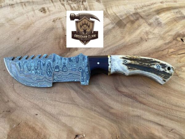 Unique Handmade Damascus Steel Blade "11"Tracker Knife With Unique Stag Handle and leather sheath. 

Overall length: 11 inches. 

Handle Length: "5"

Blade Length: "6" - Image 2