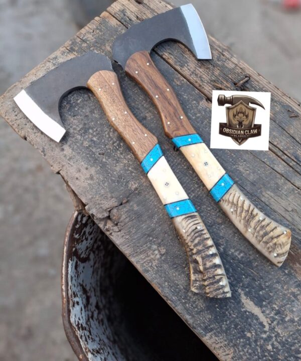 Lot of "2" Handmade 1095 high carbon steel vikings  throwing hatchet  with leather cover. 
Handle made with the combination  of ram horn and camel bone and rose wood scales . Blue Turkish spacers.  Approximately  17 inches long.
6 inches head width.