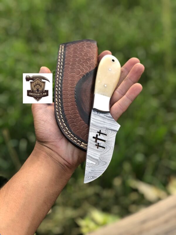 Handmade High carbon Damascus steel "8" Skinner knife with including leather cover.