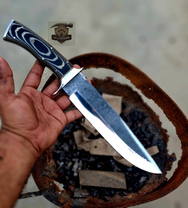 Custome Handmade J2 steel Bowie knife with leather sheath.