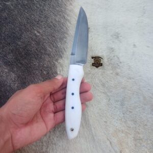 High carbon steel blade with leather sheath.
