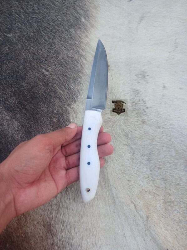 High carbon steel blade with leather sheath.