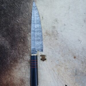 Damascus steel chef knife with leather sheath.
