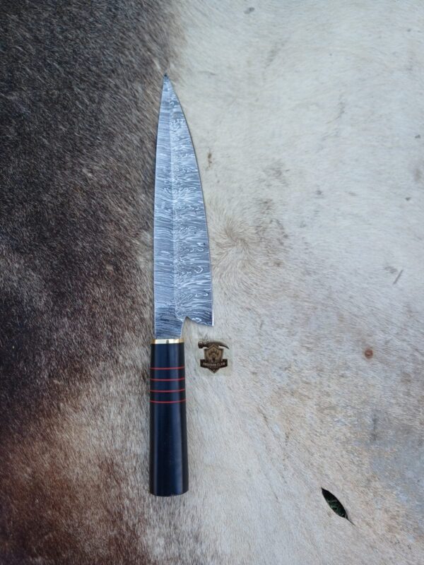 Damascus steel chef knife with leather sheath.