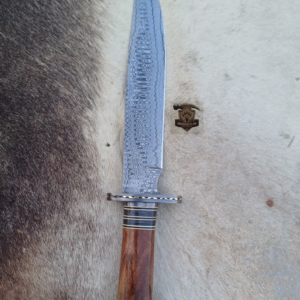 Damascus steel Bowie knife with leather sheath.