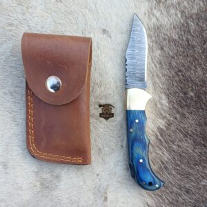 Handcrafted Damascus folding knife with leather cover.
