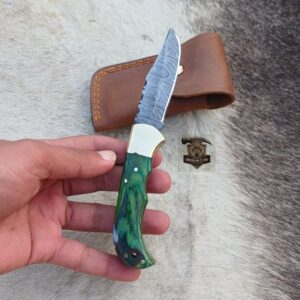 Handcrafted Damascus folding knife with leather cover.