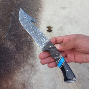 Damascus steel Gut hook knife with leather sheath.