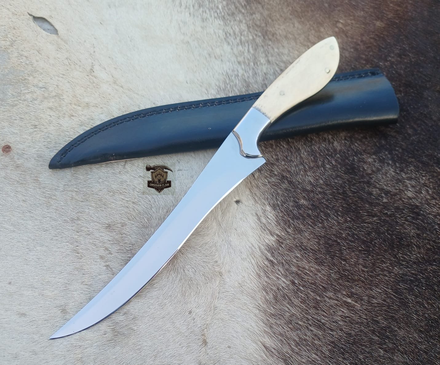 Fishing Fillet knife with leather sheath.