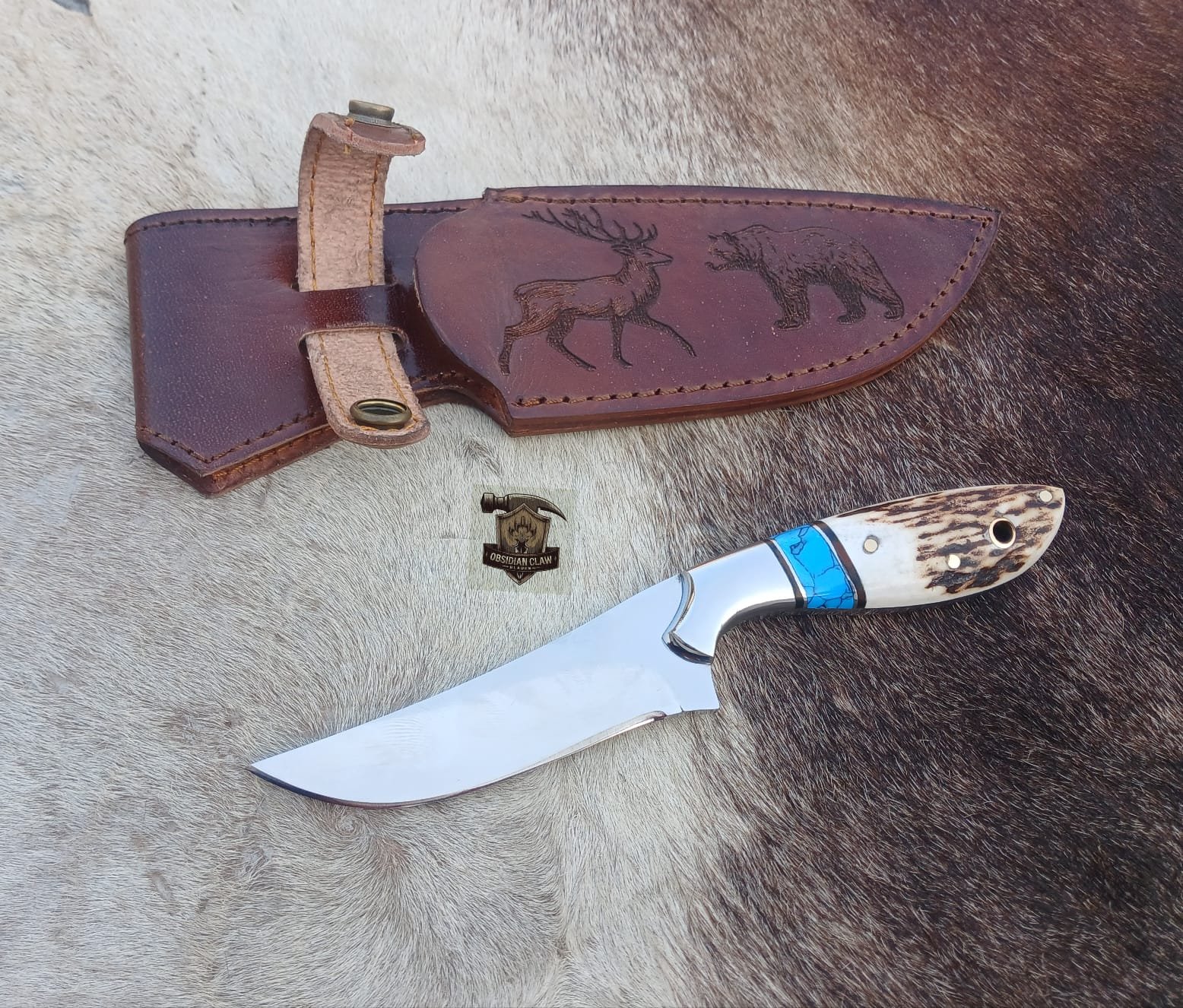 Skinner knife with leather sheath.