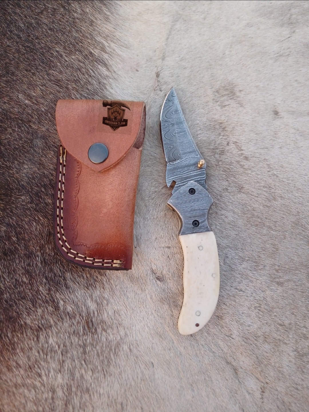 Linear Folding knife with Leather cover.